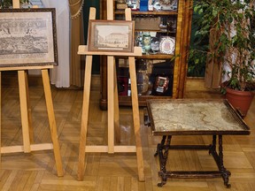 This photo taken Sunday, Feb. 26, 2017 in Krakow, Poland shows an 18-century map of Poland built into a small table and two old drawings that were returned to Poland Sunday by Austria’s Horst von Waechter, whose family had looted them from Krakow during World War II. (Office of the Governor Malopolska via AP)