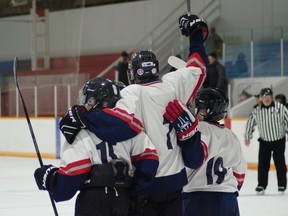 The bantam Chinooks celebrate goal by Dillon Stevenson, No. 7, giving the team the lead 4-1 in the first period in their semi-final game against Rockyford. | Caitlin Clow photo/Pincher Creek Echo