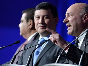 Kevin O'Leary speaks as Michael Chong looks on, during a Conservative Party leadership debate at the Manning Centre conference, on Friday, Feb. 24, 2017 in Ottawa. THE CANADIAN PRESS/Justin Tang