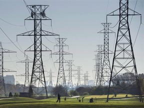 Hydro towers are seen over a golf course in Toronto in November 2015. (THE CANADIAN PRESS)