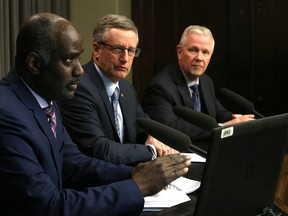 Fisaha Unduche (left) considers his answer as Infrastructure minister Blaine Pedersen (centre) and deputy minister Doug McMahon look on during the province's first flood outlook at the Manitoba Legislative Building in Winnipeg on Mon., Feb. 27, 2017. Kevin King/Winnipeg Sun/Postmedia Network