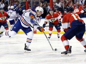 Edmonton Oilers center Ryan Nugent-Hopkins takes a shot in front of Florida Panthers defenceman Mark Pysyk on Wednesday, Feb. 22, 2017, in Sunrise, FL. (Lynne Sladky/AP Photo)