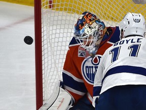 Edmonton Oilers goalie Cam Talbot makes a save on Tampa Bay Lightning Brian Boyle at Rogers Place on Dec. 17, 2016. (Ed Kaiser)