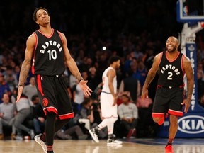 Toronto Raptors guard DeMar DeRozan and forward P.J. Tucker celebrate after DeRozan hit a turnaround jumper in the waning seconds of the fourth quarter of an NBA game against the New York Knicks at Madison Square Garden on Feb. 27, 2017. (AP Photo/Kathy Willens)