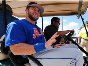 New York Mets outfielder and former NFL quarterback Tim Tebow leaves a news conference at the baseball teams spring training facility in Port St. Lucie, Fla., Monday, Feb. 27, 2017. (AP Photo/John Bazemore)