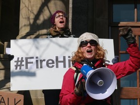 Hope Jamieson Baggs (rear) and Kelly Hickey take part in a rally at police headquarters in St. John's on February 27, 2017 following a weekend of outrage after a Newfoundland officer was acquitted of sexual assault. A jury Friday found Const. Doug Snelgrove not guilty after he drove an intoxicated woman home from the bar district while on duty and had sex with her in 2014. (THE CANADIAN PRESS/Paul Daly)