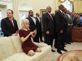 Counselor to the President Kellyanne Conway, on the couch as U.S. President Donald Trump, right, meets with leaders of Historically Black Colleges and Universities (HBCU) in the Oval Office of the White House in Washington, Monday, Feb. 27, 2017.   (AP Photo/Pablo Martinez Monsivais)