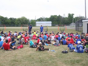 Former major league players Scott Bullett and Bret Saberhagen talking to the kids in attendance at last year’s camp in Clinton. (Justine Alkema/Clinton News Record)