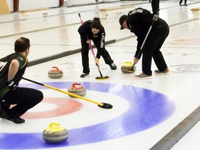Lakeland College Rustlers' Skip Branden Cookson observes his teammates Second Copper Nicholson and Third Kaylee Duncan sweep during their Alberta Colleges Athletic Conference Curling Championship game against the MacEwan Griffins at the Vermilion Curling Arena on Friday, February 24, 2017, in Vermilion, Alta. Taylor Hermiston/Vermilion Standard/Postmedia Network.