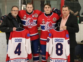 Strathroy Rockets’ president Don Windsor, left, and vice president Kent Coleman, right, honour graduating players Dalton Good and Steve Griggs prior to the start of the Rockets’ final game of the season. Photo courtesy of Colleen Wiendels Photography.