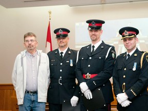 Pictured above: Edward Hodgetts (left), Const. Patrick Wuytenburg, Const. Paul Westendorp, and Strathroy-Caradoc Deputy-Chief Mark Campbell. File photo.
