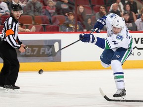 Alexandre Burrows of the Vancouver Canucks shoots the puck against the Arizona Coyotes during an NHL game at Gila River Arena on Nov. 23, 2016 in Glendale, Arizona. (Christian Petersen/Getty Images)