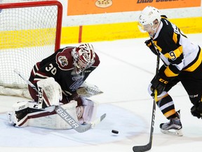 Peterborough Petes goalie Dylan Wells stops Kingston Frontenacs' Nathan Dunkley during third period Ontario Hockey League action earlier this month at the Memorial Centre in Peterborough. (Clifford Skarstedt/Postmedia Network)