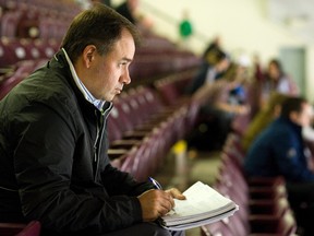 Pierre Dorion of the Ottawa Senators takes notes during OHL action between the Peterborough Petes and London Knights on Oct. 25, 2012 at the Memorial Centre in Peterborough. (CLIFFORD SKARSTEDT/PETERBOROUGH EXAMINER)