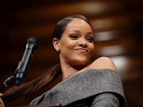 Singer Rihanna addresses an audience after being presented with the 2017 Harvard University Humanitarian of the Year Award during ceremonies, Tuesday, Feb. 28, 2017, at the Sanders Theatre on the school's campus, in Cambridge, Mass. (AP Photo/Steven Senne)