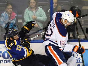 St. Louis Blues' Jori Lehtera (12) collides with Edmonton Oilers' Eric Gryba (62) Tuesday, Feb. 28, 2017, in St. Louis. (Bill Boyce/AP Photo)