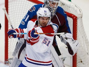 Montreal Canadiens center David Desharnais, front, screens Colorado Avalanche goalie Calvin Pickard during the first period of an NHL hockey game Tuesday, Feb. 7, 2017, in Denver.The Oilers acquired Desharnais on Tuesday in exchange for defenceman Brandon Davidson.