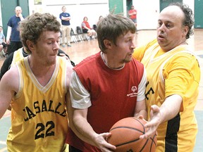 Tillsonburg Wildcats' Corey Mulholland is surrounded under the basket Saturday in the Wildcats Basketball Tournament at Glendale High School. (CHRIS ABBOTT/TILLSONBURG NEWS)