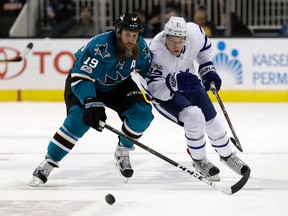 San Jose Sharks' Joe Thornton (19) skates next to Toronto Maple Leafs' Connor Brown (12) during the first period of an NHL hockey game Tuesday, Feb. 28, 2017, in San Jose, Calif. (AP Photo/Marcio Jose Sanchez)