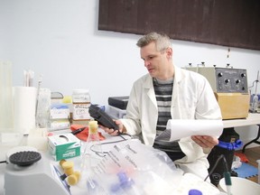 Bio-Mine CEO Kurtis Vanwallegham in his lab in Sudbury, Ont. on Tuesday February 28, 2017. Gino Donato/Sudbury Star/Postmedia Network