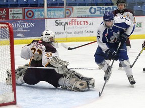 Brady Maltais, right, of the Sudbury Nickel Capital Wolves, attempts to fire the puck past Jimmy Carleton, of the Timmins Majors, during hockey action at the Sudbury Community Arena in Sudbury, Ont. on Saturday February 11, 2017. The Nickel Caps are getting ready to face the North Bay Trappers in the Great North Midget League final.  John Lappa/Sudbury Star/Postmedia Network