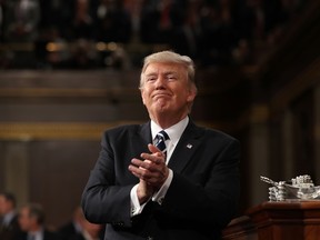US President Donald J. Trump reacts after delivering his first address to a joint session of Congress from the floor of the House of Representatives in Washington, DC, USA, 28 February 2017. / AFP PHOTO / POOL / JIM LO SCALZOJIM LO SCALZO/AFP/Getty Images