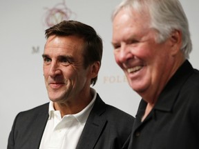 In this July 13, 2016, file photo, George McPhee, left, and NHL's expansion Las Vegas franchise owner Bill Foley attend a news conference in Las Vegas. (AP Photo/John Locher, File)