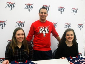 Loyalist Lancers women's basketball coach Jamie McCourt welcomes his two newest recruits: Brittany Mason (left) of Navan and Belleville native Alex Sagriff. (Loyalist Athletics photo)