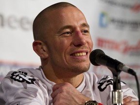 UFC fighter Georges St. Pierre speaks during a press conference in Edmonton on Jan. 11, 2014. (Ian Kucerak/Edmonton Sun)
