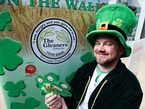Tim Miller/The Intelligencer
Matthew Bewsky, in full leprechaun attire, shows off a handful of shamrocks at the Quinte Mall as Gleaners Food Bank kicks off its Shamrocks on the Wall fundraiser on Wednesday in Belleville.