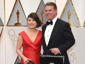 This Feb. 26, 2017 file photo shows Martha L. Ruiz, left, and Brian Cullinan from PricewaterhouseCoopers at the Oscars in Los Angeles. Film academy president Cheryl Boone Isaacs says the two accountants responsible for the best picture mistake will not work the Oscars again. Cullinan and Ruiz were responsible for the winners’ envelopes at Sunday’s Oscar show. Cullinan tweeted a photo of Emma Stone from backstage minutes before handing presenters Warren Beatty and Faye Dunaway the wrong envelope for best picture. Boone Isaacs said Cullinan’s distraction caused the error.(Photo by Jordan Strauss/Invision/AP, File)
