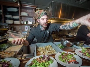 Submitted photo
Kalon Gibson, kitchen manager at Earl and Angelos, serves a salad made from all local products. It will be featured on the Quintelicious menu at the downtown Belleville restaurant.