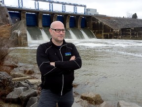 Mark Helsten, senior water resources engineer for the Upper Thames River Conservation Authority, keeps a eye on the rising Thames River at the Fanshawe Dam on Wednesday March 1, 2017. (MORRIS LAMONT, The London Free Press)