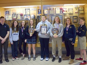 St. Joesph’s wrestling coach Wolff Schweitzer, left, Nikky Laframboise, Kaily Meehan, Sydney Woodhouse, Mackenzie Millar, Meredith Woodhouse, Alex Cooper and Aiden Woodhouse are ready to head to the OFSAA championship in Brampton. (Contributed Photo)
