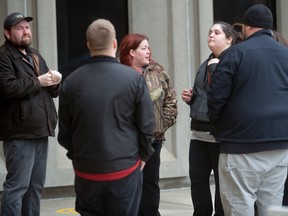 Family and friends of Jeremy (Beau) Taylor, who was stabbed to death in 2014, gather outside the London courthouse Wednesday after Adam Keith, who pleaded guilty to manslaughter in the case, was sentenced to seven years in prison. (MORRIS LAMONT, The London Free Press)