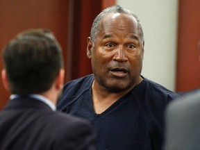 O.J. Simpson stands at the end of an evidentiary hearing in Clark County District Court on May 17, 2013 in Las Vegas, Nevada. (Photo by Steve Marcus-Pool/Getty Images)
