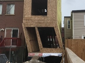 A home under construction on Leslie St., just south of Queen St. E., is seen Thursday, March 3, 2017 after being rocked by strong winds the night before. (@Toronto_Fire)