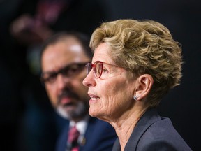 Ontario Premier Kathleen Wynne, along with Energy Minister Glenn Thibeault, announce cuts to hydro rates during a press conference in Toronto on Thursday, March 2, 2017. (Ernest Doroszuk/Toronto Sun)