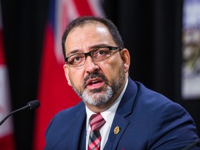 Ontario Energy Minister Glenn Thibeault joins Ontario Premier Kathleen Wynne (not pictured) at a press conference announcing cuts to hydro rates on average of 25 per cent during a press conference in Toronto, Ont. on Thursday March 2, 2017. Ernest Doroszuk/Toronto Sun/Postmedia Network