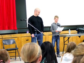 BRUCE BELL/THE INTELLIGENCER
Andrew Smith is introduced to students at Holy Rosary Catholic School on Thursday morning by student Andrew Campbell. The Grade 5 student was named after Smith who is a close family friend. Smith has made the list of the final 72 for the next two members of Canadian Space Agency’s (CSA) astronaut program.