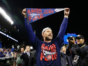 In this Oct. 22, 2016, file photo, Chicago Cubs catcher David Ross celebrates after Game 6 of the National League baseball championship series against the Los Angeles Dodgers in Chicago. Ross, who retired after helping the Cubs win the World Series last year, is part of the 24th season of “Dancing with the Stars,” and his former teammates are excited to watch the ex-catcher on the show. (AP Photo/Nam Y. Huh, File)