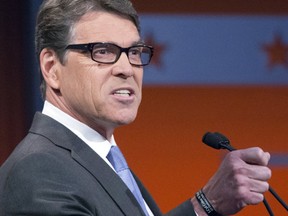 Former Texas Gov. Rick Perry has been confirmed as energy secretary. (AP Photo/John Minchillo)
