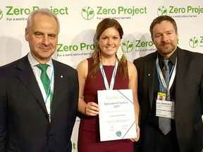 Community Living Sarnia-Lambton's Laura Stokley and Bob Vansickle, right, are pictured in Vienna recently, receiving an award for their agency's Summer Employment Transitions program. Also pictured is Wilfried Kainz who presented the award on behalf of Zero Project. (Submitted)