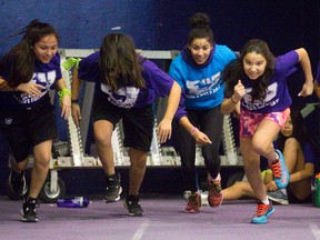 Joy Spear Chief-Morris, a hurdles and sprint athlete at Western University teaches starts at Western's Indigenous Services annual track and field day for local youth in London, Ont. on Wednesday February 17, 2016. (Free Press file photo)