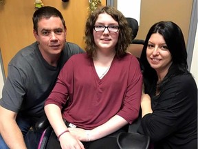 Madison Arseneault, 15, is shown with her parents, Andrew and Shirley, in this photo provided by the Arseneault family. Madison's skull was impaled by a sawed-off golf club on May 25, 2016 during an elementary school physical education class in Windsor, Ont. (Arseneault family photo)