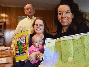 From left, Louis Roesch, Katrina Sterling, little Hazel Sterling, and Mary-Anne Udvari got together to promote the new Buy Local! Buy Fresh! feature coming out this spring. Roesch, Sterling, and Udvari are all with the KFA, the group running point on the local ag bruchure.