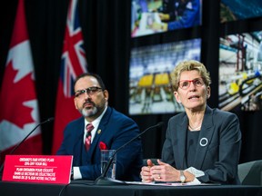 Ontario Premier Kathleen Wynne, along with Ontario Energy Minister Glenn Thibeault, announce cuts to hydro rates on average of 25 per cent during a press conference in Toronto on  March 2, 2017. (Ernest Doroszuk/Toronto Sun/Postmedia Network)