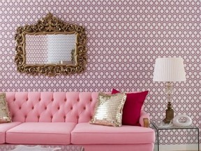In the pink ? reupholstering a client's old sofa and adding hex wallpaper proved perfect foils to the gold accents.