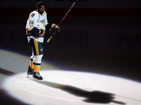 Nashville Predators' P.K. Subban salutes fans of his former team prior to facing the Montreal Canadiens in NHL hockey action, in Montreal on March 2, 2017. (THE CANADIAN PRESS/Paul Chiasson)