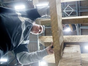 Mike Demers, a carpenter with SLV Homes, constructs a pergola at the Sudbury Community Arena in Sudbury, Ont. on Thursday March 2, 2017.  Gino Donato/Sudbury Star/Postmedia Network